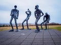 Four green alien-like public statues Dansleikur Dance by Torbjorg Gudrun Palsdottir