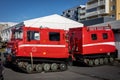 Red rescue caterpillar tractor vehicles in front of Bjorgunarmidstod (Hjalparsveit), Kopavogur, Iceland.