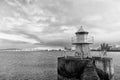 Reykjavik lighthouse tower on stone pier in iceland. lighthouse in sea. architecture in seascape and skyline