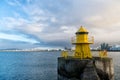 Reykjavik lighthouse tower on stone pier in iceland. lighthouse in sea. architecture in seascape and skyline