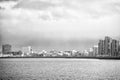 Reykjavik seascape dramatic cloudy sky. City on sea coast Iceland. Scandinavian seascape concept. Calm water surface and