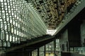 Landscape interior view of the lobby of the Harpa, a concert hall and conference center with a