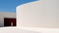 Minimalist Woman Walking In A White Courtyard