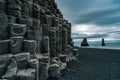 Reynisdrangar natural rock formation on Reynisfjara black sand beach in gloomy day at Iceland Royalty Free Stock Photo