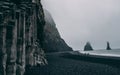 Reynisfjara black sand beach foggy basalt column hexagon stones