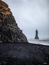 Reynisfjara black sand beach and Reynisdrangar rocks in Iceland. Famous Reynisdrangar rock formations at black beach.