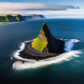 Reynisfjara Vik in is a black sand beach with enormous cinematic aerial Stunning Icelandic shoreline as seen from