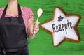 Rezepte (in german recipes) cinnamon star is shown by chef Royalty Free Stock Photo