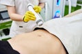 Rf skin tightening, belly. Hardware cosmetology. Ultrasound cavitation body contouring and sculpting treatment, anti-cellulite and Royalty Free Stock Photo