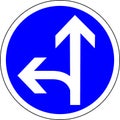 Vector illustration of a road sign showing straight and left direction. Blue color graphics of a traffic sign. Royalty Free Stock Photo