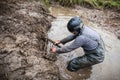 RFC Ukraine Wild Boar Challenge 2016. Pilot tries to get recovery sand tracks from deep mud. Royalty Free Stock Photo