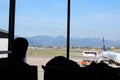 2019.09.30  Bergamo, Orio al Serio airport Ryanair plane parked in the foreground with silhoutte of passengers in backlight and in Royalty Free Stock Photo