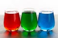 Rgb color water in glass on table Royalty Free Stock Photo