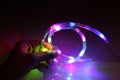 RGB Led strip which is waterproof holding in hand with glowing Colorful LED Lights Royalty Free Stock Photo