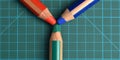 RGB red, green, blue colored pencils on a cutting mat Royalty Free Stock Photo