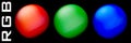 RGB. Red, green and blue spheres on black background. Vector graphics Royalty Free Stock Photo