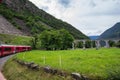 Rhaetian Railway crossing a bridge in the Surselva valley Royalty Free Stock Photo