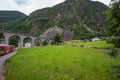 Rhaetian Railway crossing a bridge in the Surselva valley Royalty Free Stock Photo