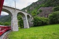 Rhaetian Railway crossing a bridge in the Surselva valley Royalty Free Stock Photo