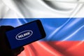 Rheinbach, Germany 4 March 2022, The brand logo of the Russian steel manufacturer `NLMK` on the display of a smartphone