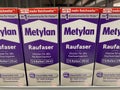 Rheinbach, Germany 17 March 2021, Several packages of Metylan woodchip wallpaper paste on the shelf of a hardware store