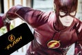 Rheinbach, Germany 19 October 2021, The `The Flash` logo on the display of a smartphone in front of a scene from the series `The