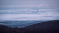 The Rhine harbour steam power plant near Karlsruhe rises out of the fog Royalty Free Stock Photo