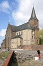 Rhine promenade with church, child and kitten