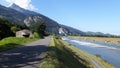 The rhine river and bicycle path with mountain and blue sky on the background