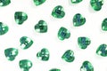 Green Rhinestone background. Heart shape texture as backdrop isolated white studio photo. Bling rhinestone crystal