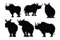 Rhino standing in different positions, silhouette set vector. Adult rhino silhouette collection on a white background. Wild Royalty Free Stock Photo