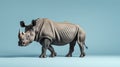 Rhinoceros standing against a vibrant blue background