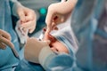 Rhinoplasty men, the surgeon s gloved hands hold the instruments during nose surgery. Doctor in gloves holds a medical