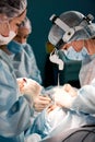 Rhinoplasty men, the surgeons gloved hands hold the instruments during nose surgery. Doctor in gloves holds a medical