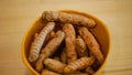 Rhizome of turmeric roots Curcuma longa in bowl, Indian saffron is cooked are dried and ground to a yellow powder. Used Royalty Free Stock Photo