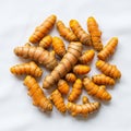 Rhizomes Curcuma longa are arranged in a circular pattern on a Royalty Free Stock Photo