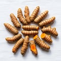 Rhizomes (Curcuma longa) arranged in a circular pattern on a Royalty Free Stock Photo