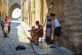 Street musicians at narrow street of Rhodes town on Rhodes island, Greece Royalty Free Stock Photo