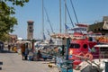 RHODES, Greece Ã¢â¬â JUN 07, 2021. Mandraki Harbour in Rhodes with the bell tower of the Church of the Evangelismos Annunciation Royalty Free Stock Photo
