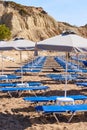 Sun loungers with umbrellas on sandy Kolymbia beach. Rhodes island, Greece Royalty Free Stock Photo