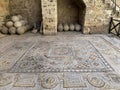 Antique mosaic and cannonballs in courtyard of the Archaeological Museum of Rhodes