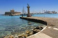 Rhodes Mandraki harbor with castle and symbolic deer statues, Greece Royalty Free Stock Photo