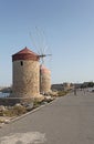 Rhodes Mandraki harbour wind mills. Greece
