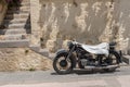 Rhodes Town, Greece. 05/30/2018. BMW R12 motorcycle covered in white towel to protect from scorching sun. Island of Rhodes. Europe