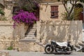 Rhodes Town, Greece. 05/30/2018. BMW R12 motorcycle covered in white towel to protect from scorching sun. Island of Rhodes. Europe
