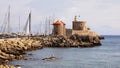 Rhodes, windmills and fort of Saint Nicholas in Mandraki harbour. Rhodes, Greece Royalty Free Stock Photo