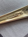 Rhodium plate stamped on 1940s cutlery handle rhodium first used in 1930s for cutlery sets,