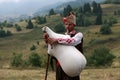 Rhodope pipers playing and resound with their bagpipes majestic Rhodope Mountains in Bulgaria Royalty Free Stock Photo