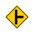 Rhomboid traffic signal in yellow and black, isolated on white background. Warning of side road on the right at a perpendicular