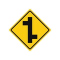 Rhomboid traffic signal in yellow and black, isolated on white background. Warning of side roads on right and left, consecutively